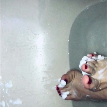 Mistress Andrea Parker's feet take a bath