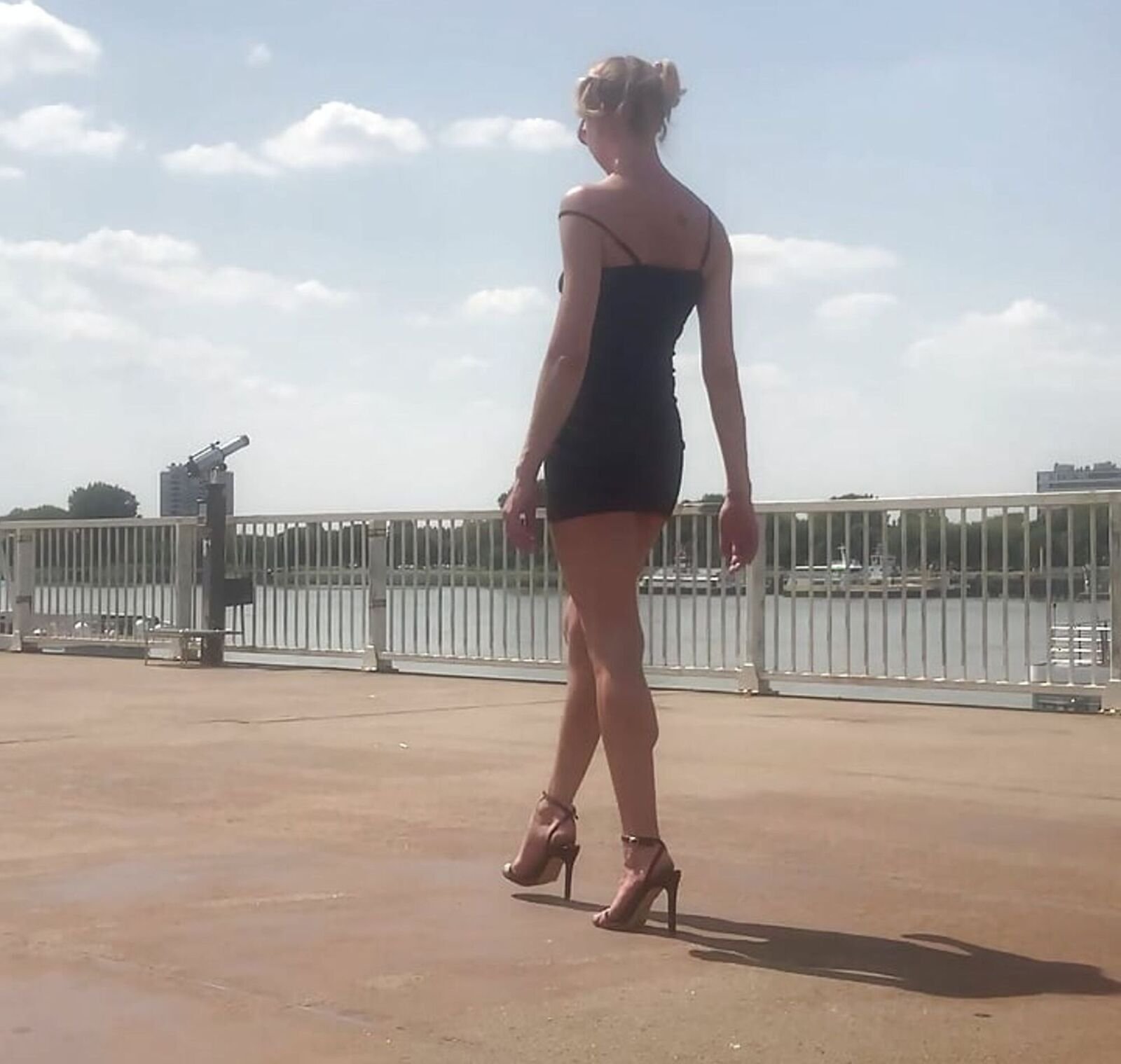 Black high heel sandals by the river