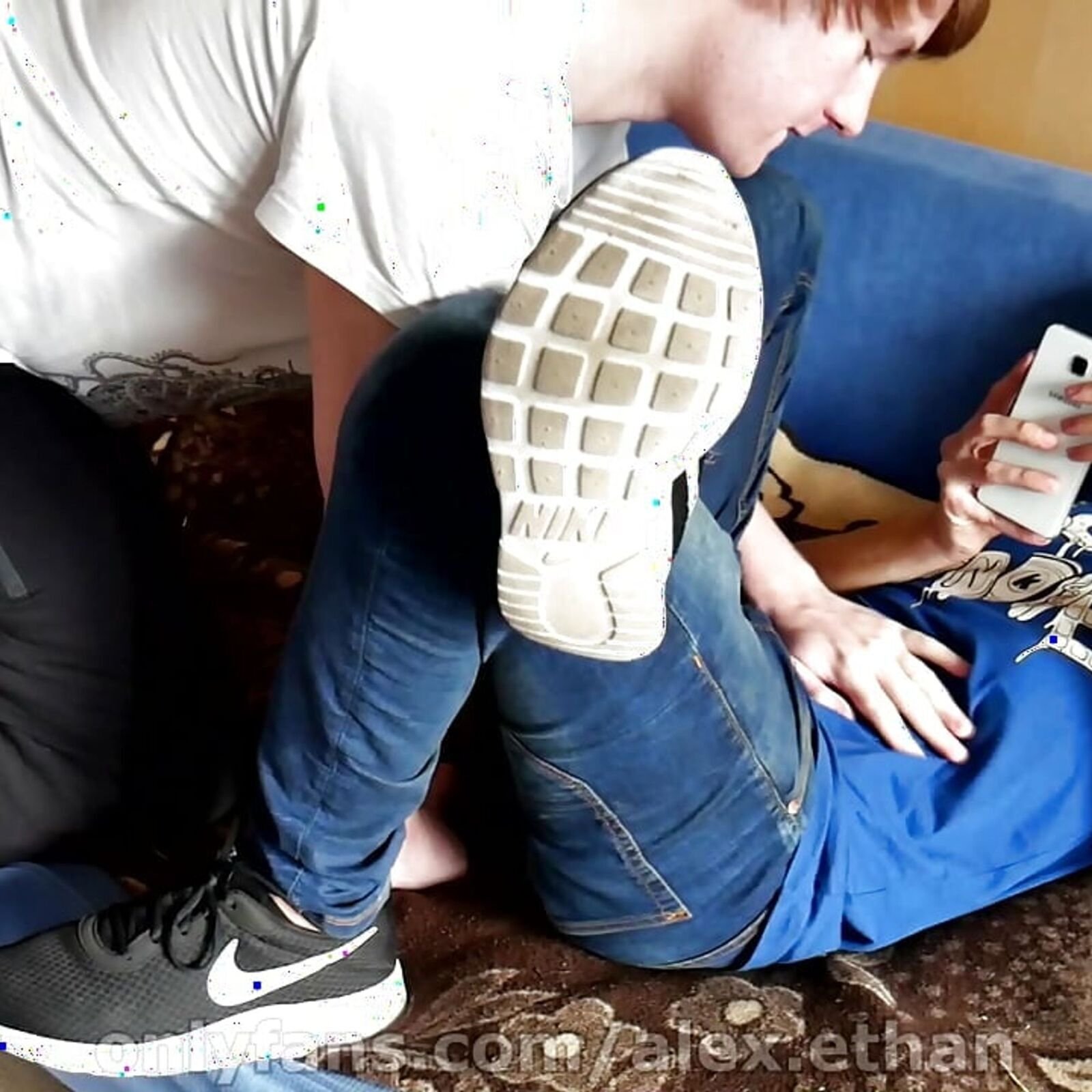 Teen lad gives me his legs in sneakers and black socks